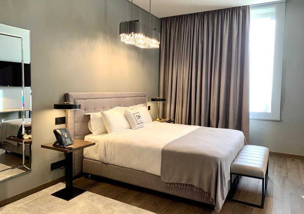 Postel nebo postele na pokoji v ubytování DS Hotel Lusopark