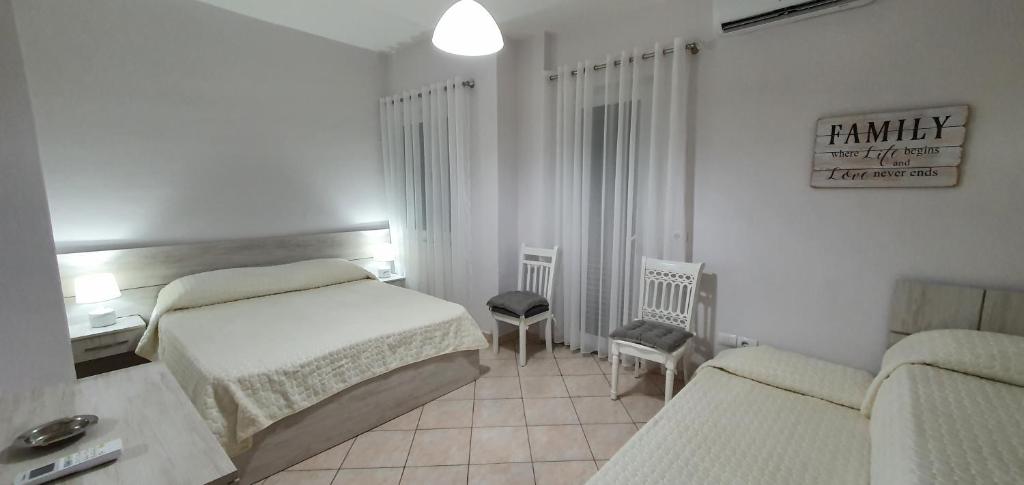 Postel nebo postele na pokoji v ubytování Sunset Apartment
