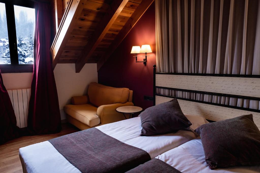Postel nebo postele na pokoji v ubytování Hotel Valle De Izas