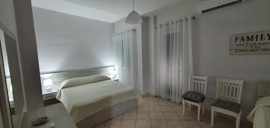 Postel nebo postele na pokoji v ubytování Sunset Apartment