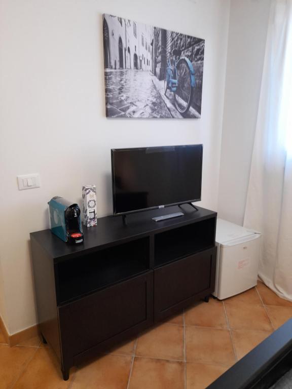 Telewizja i/lub zestaw kina domowego w obiekcie Villa Vittorio