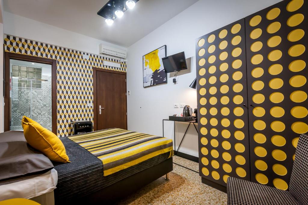 Postel nebo postele na pokoji v ubytování Hotel Bologna