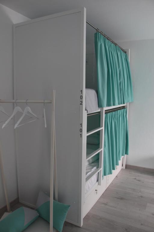 Postel nebo postele na pokoji v ubytování ArouceHostel