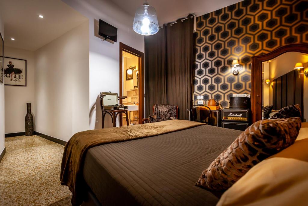 Postel nebo postele na pokoji v ubytování Hotel Bologna