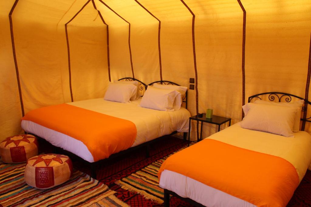 Postel nebo postele na pokoji v ubytování Luxury Bega Camp
