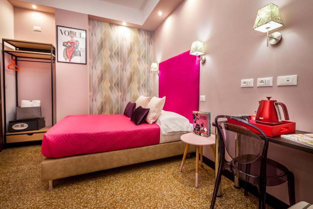 Postel nebo postele na pokoji v ubytování Hotel Bologna