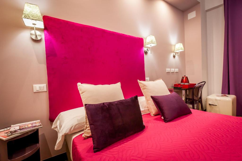 Postel nebo postele na pokoji v ubytování Hotel Bologna