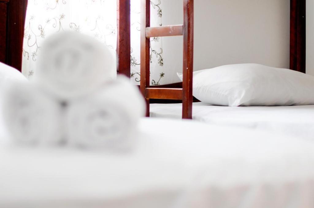 Postel nebo postele na pokoji v ubytování Hotel Rumbo al Sol
