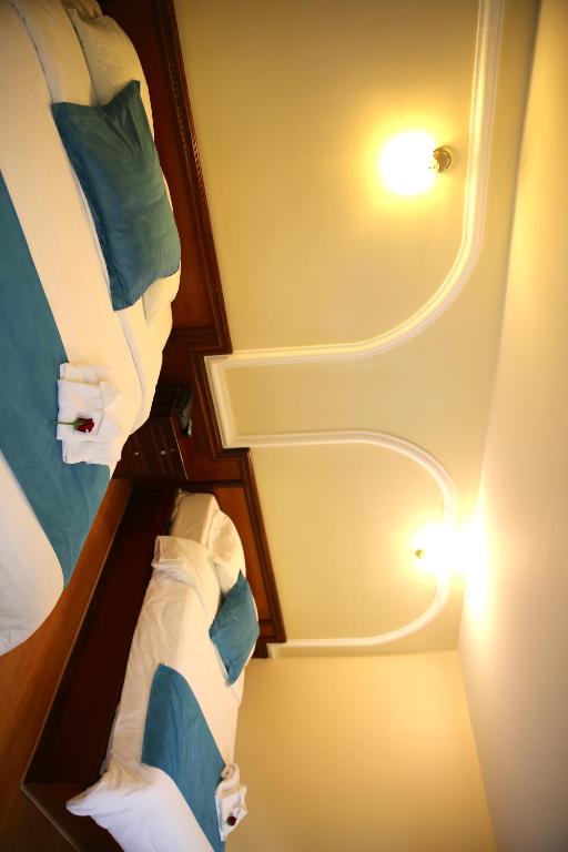 Postel nebo postele na pokoji v ubytování Hotel Donde Marcelo