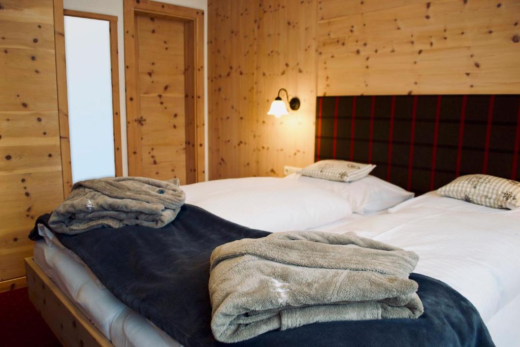 Postel nebo postele na pokoji v ubytování Birg 1414