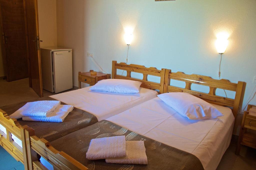 Postel nebo postele na pokoji v ubytování Stavroula Rooms