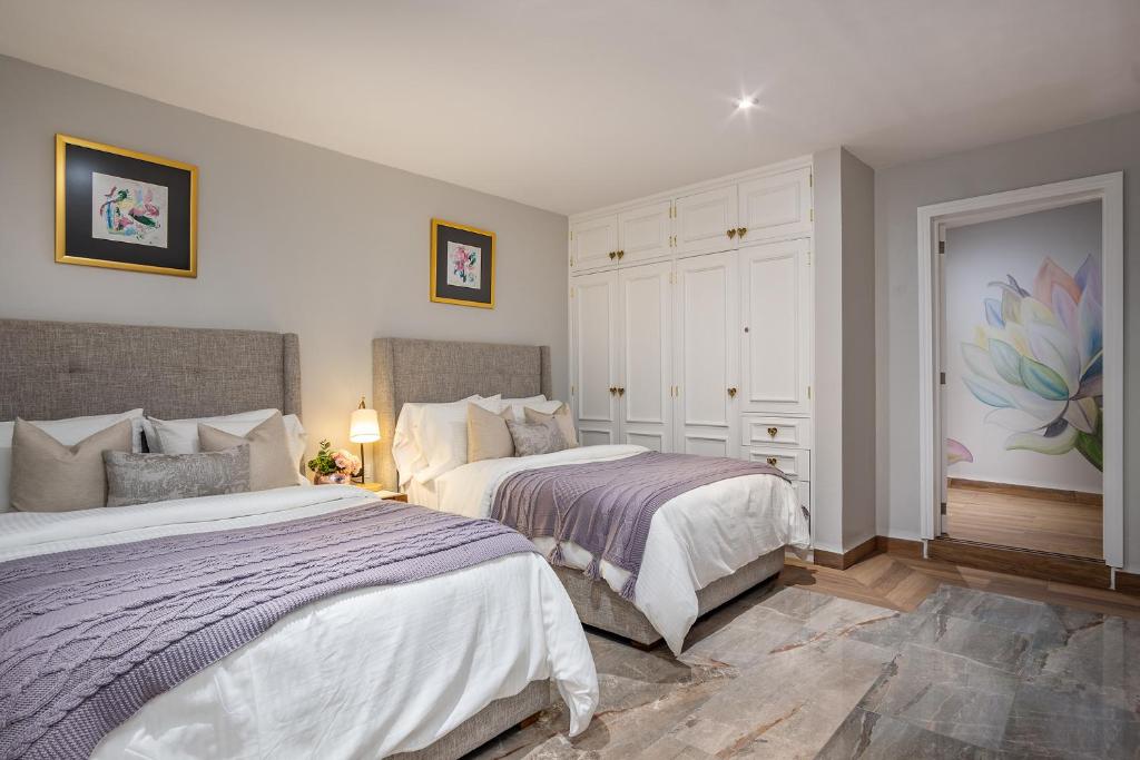 Postel nebo postele na pokoji v ubytování Hotel Casa Arum
