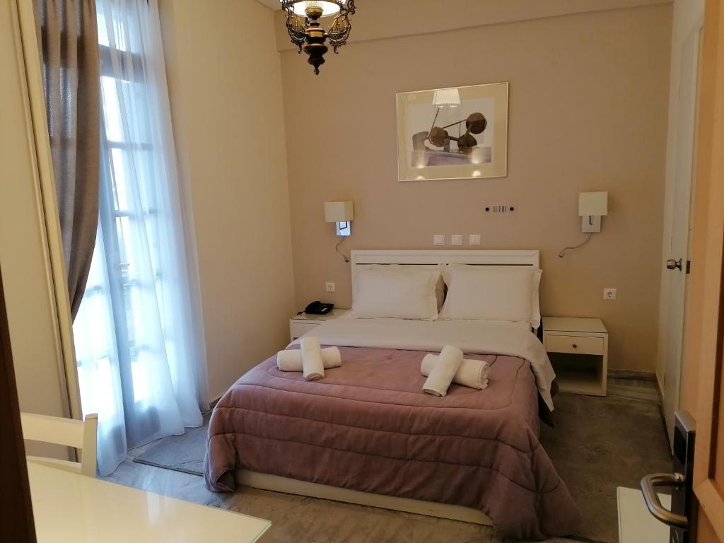 Postel nebo postele na pokoji v ubytování Hotel Galaxidi
