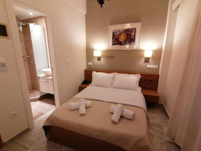 Postel nebo postele na pokoji v ubytování Hotel Galaxidi
