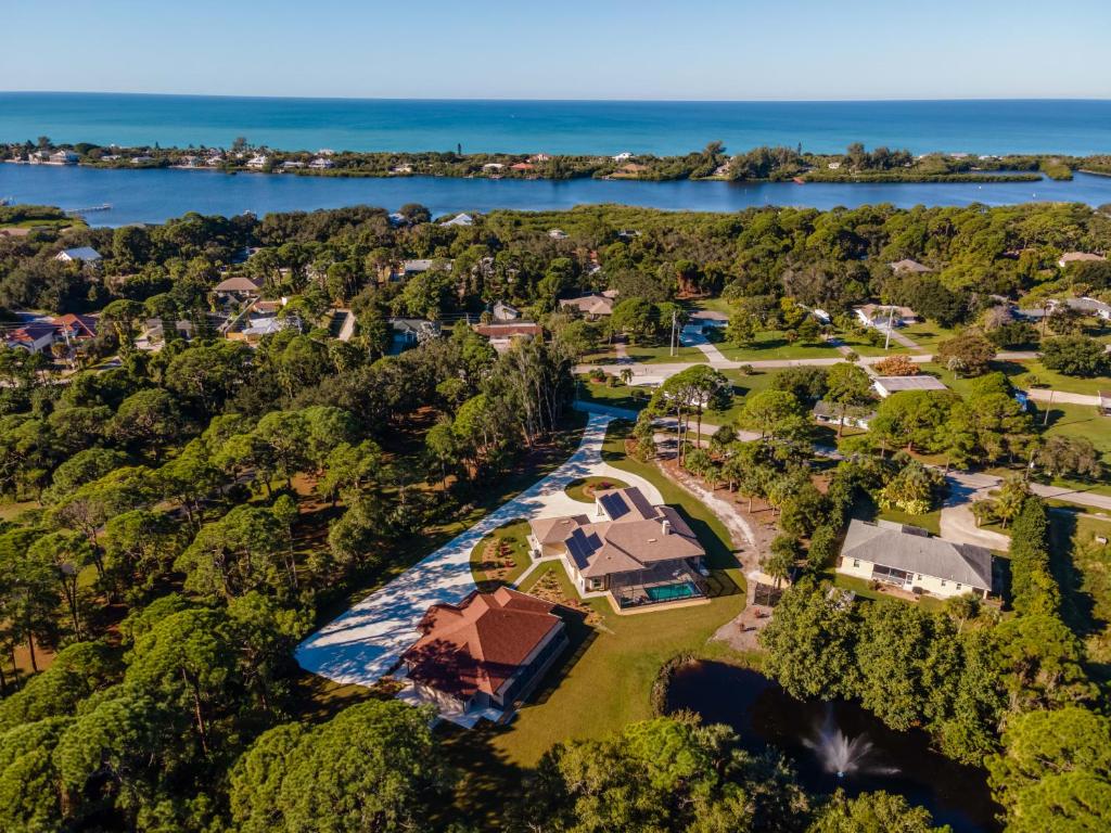 an aerial view of a home with the ocean in the background at Short term vacation rental luxury B&B CTH in Englewood