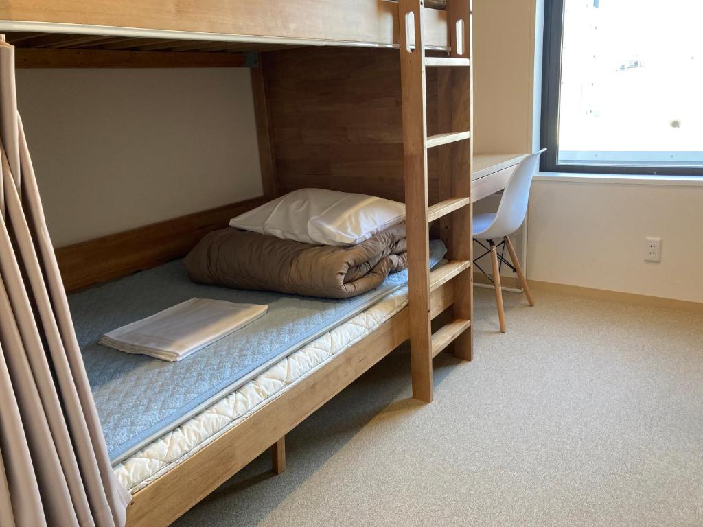Postel nebo postele na pokoji v ubytování Tokyo Ueno Youth Hostel
