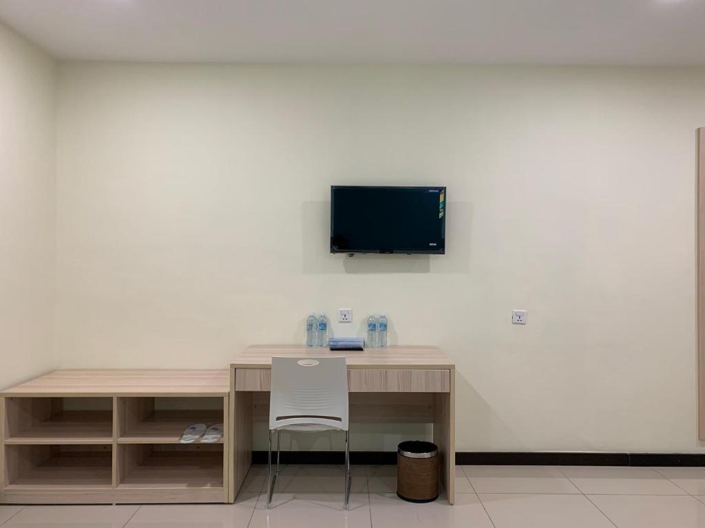 TV a/nebo společenská místnost v ubytování M Quality Hotel