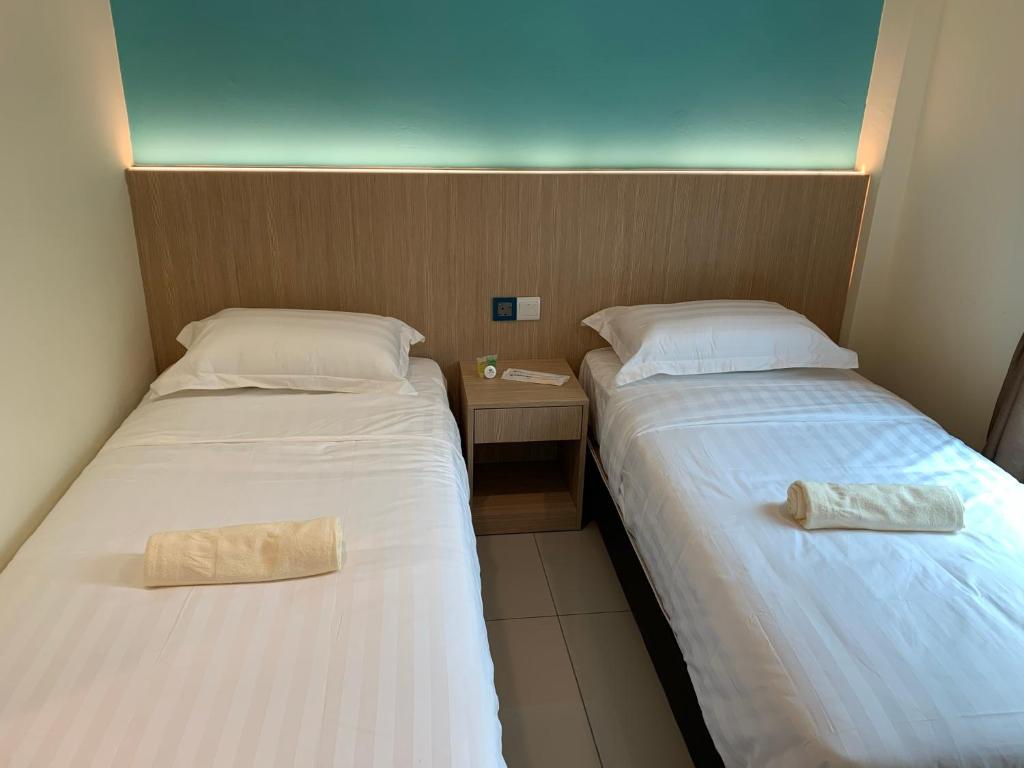 Postel nebo postele na pokoji v ubytování M Quality Hotel
