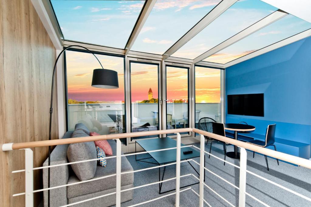 Μια τηλεόραση ή/και κέντρο ψυχαγωγίας στο Apartamenty In - Prywatne Apartamenty - Maloves Władysławowo