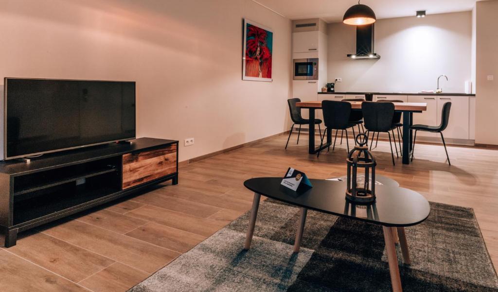 TV a/nebo společenská místnost v ubytování Appartementen by WP Hotels