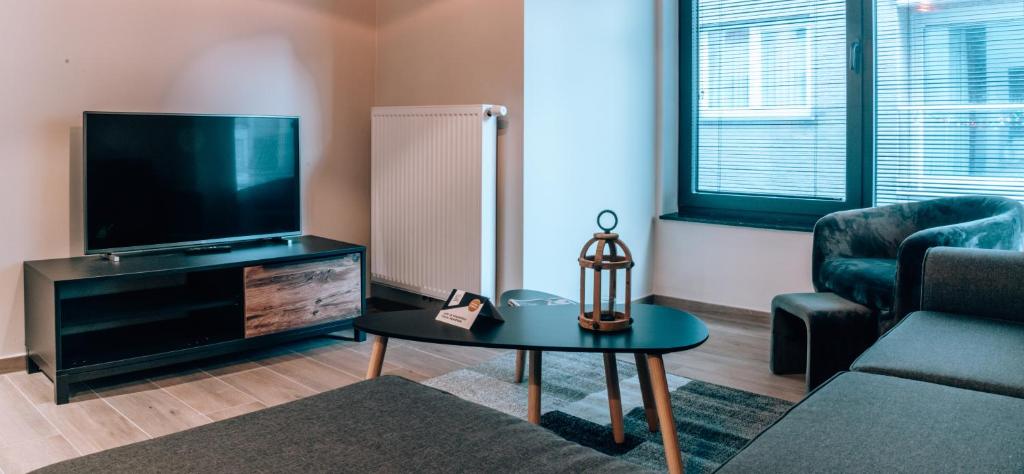 TV a/nebo společenská místnost v ubytování Appartementen by WP Hotels