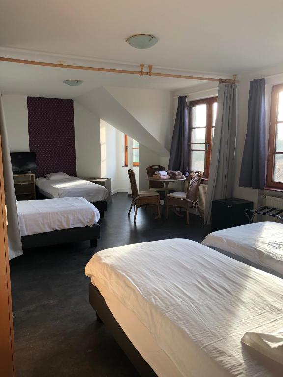 Postel nebo postele na pokoji v ubytování Hotel Hinterland