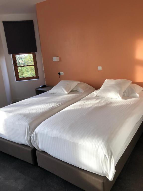 Postel nebo postele na pokoji v ubytování Hotel Hinterland