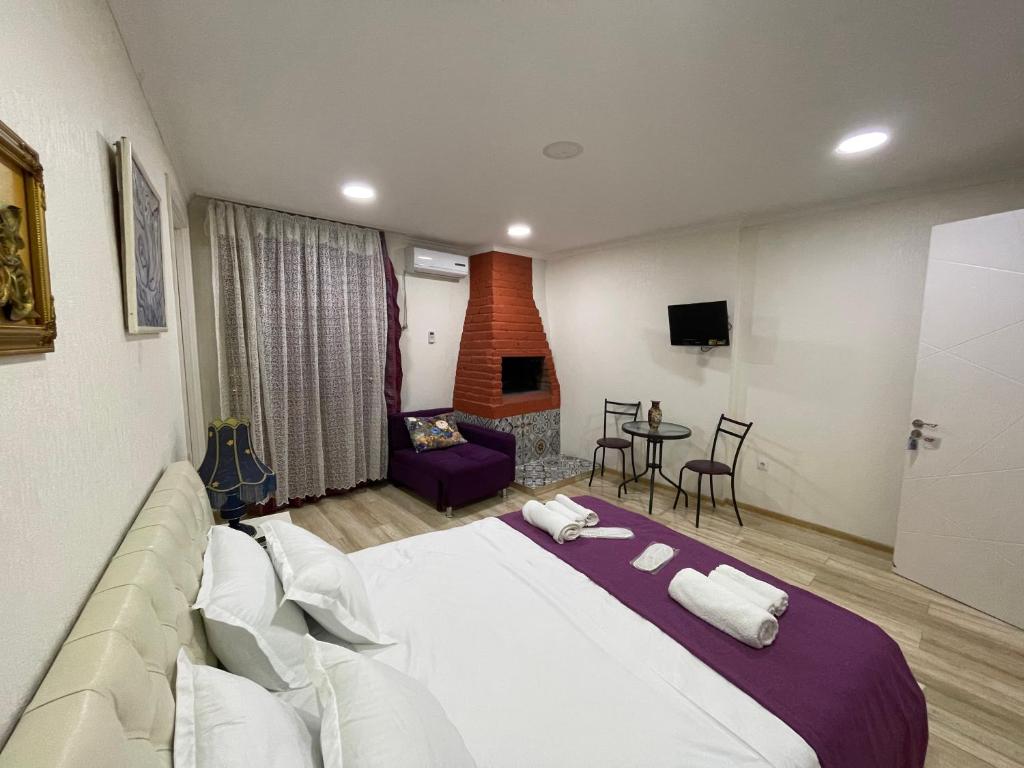 Postel nebo postele na pokoji v ubytování AA Hotel