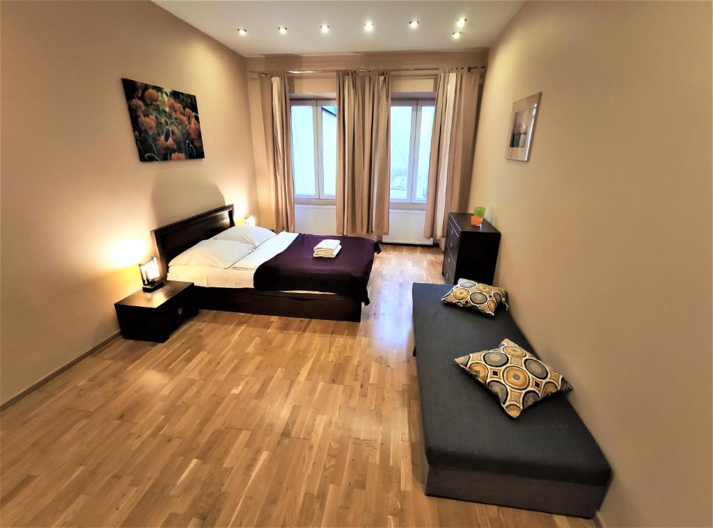 Posteľ alebo postele v izbe v ubytovaní Abak Krakow Apartment