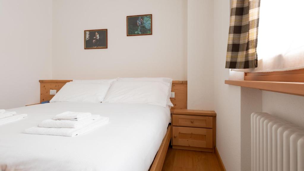 Postel nebo postele na pokoji v ubytování Italianway - Adda 10