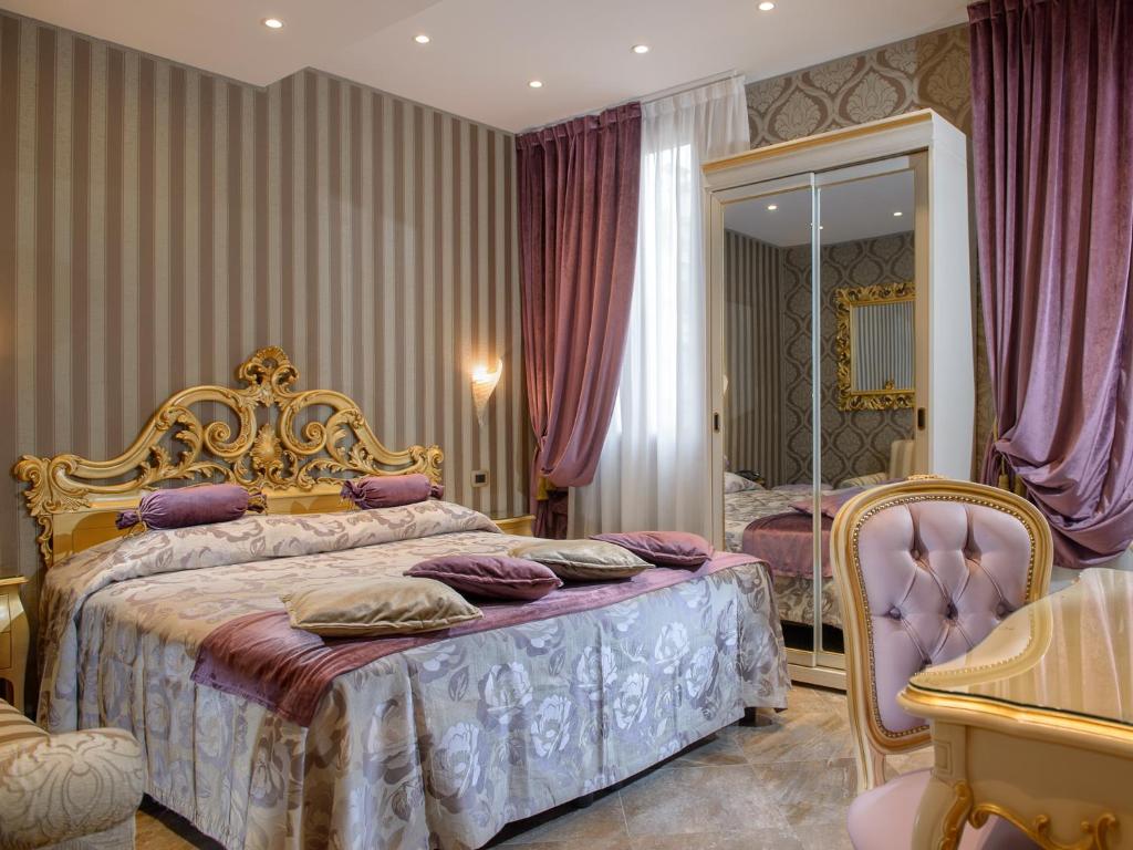 Postel nebo postele na pokoji v ubytování Hotel Santa Marina