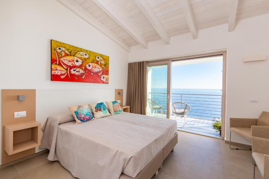 Postel nebo postele na pokoji v ubytování Hotel Caramare