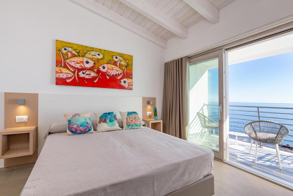 Postel nebo postele na pokoji v ubytování Hotel Caramare