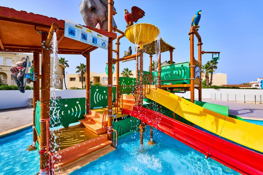 a colorful water slide in a water park at Globales Cala'n Bosch in Cala en Bosc