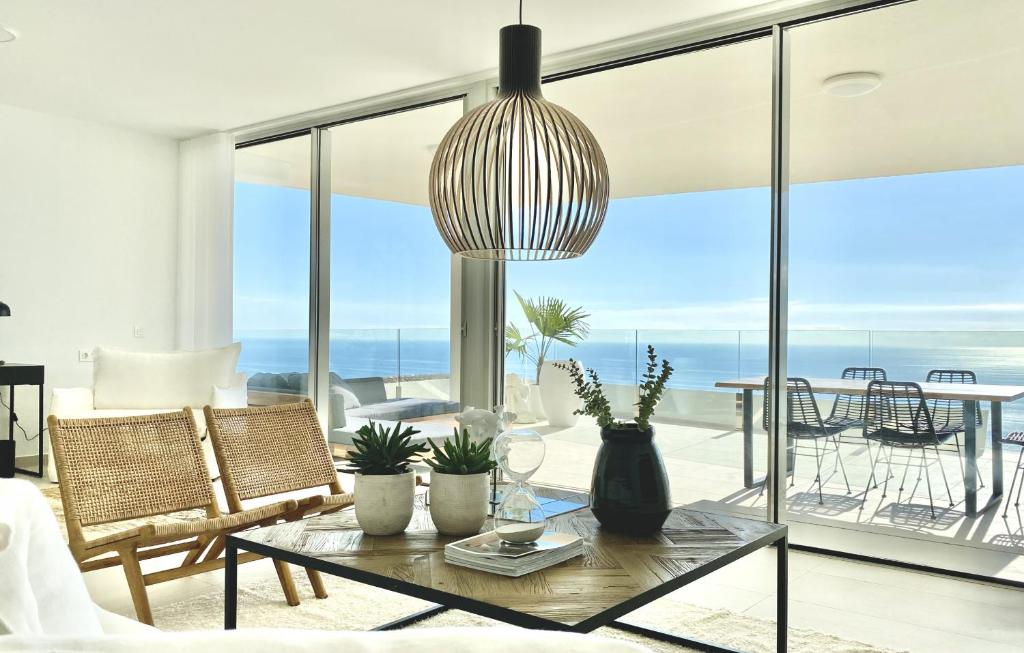 a living room with a view of the ocean at Stupa Hills - Superb Luxury Apartment Sea Views in Benalmádena