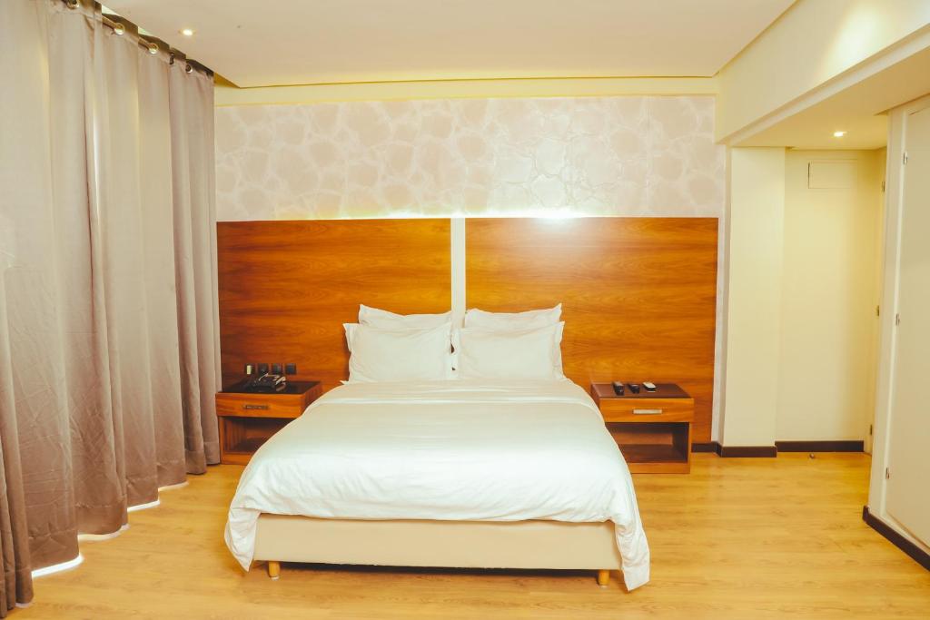 Postel nebo postele na pokoji v ubytování Hotel Perce Neige