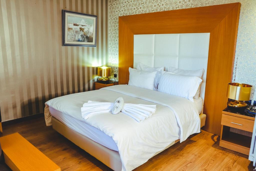 Postel nebo postele na pokoji v ubytování Hotel Perce Neige