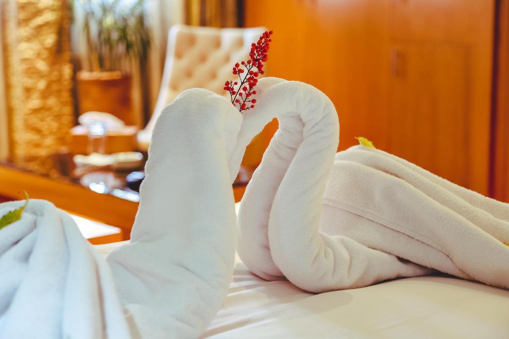Postel nebo postele na pokoji v ubytování Hotel Perce Neige