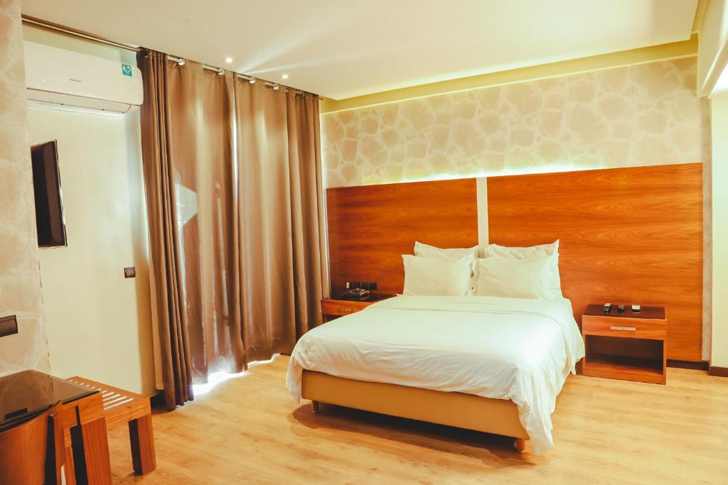 Postel nebo postele na pokoji v ubytování Hotel Perce Neige