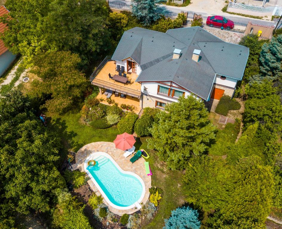 an aerial view of a house with a swimming pool at Holiday home Balatonalmadi - Balaton 17957 in Balatonalmádi