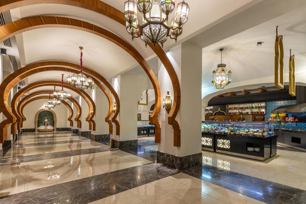 a lobby of a hotel with chandeliers at Spice Hotel & Spa - Ultra All Inclusive in Belek