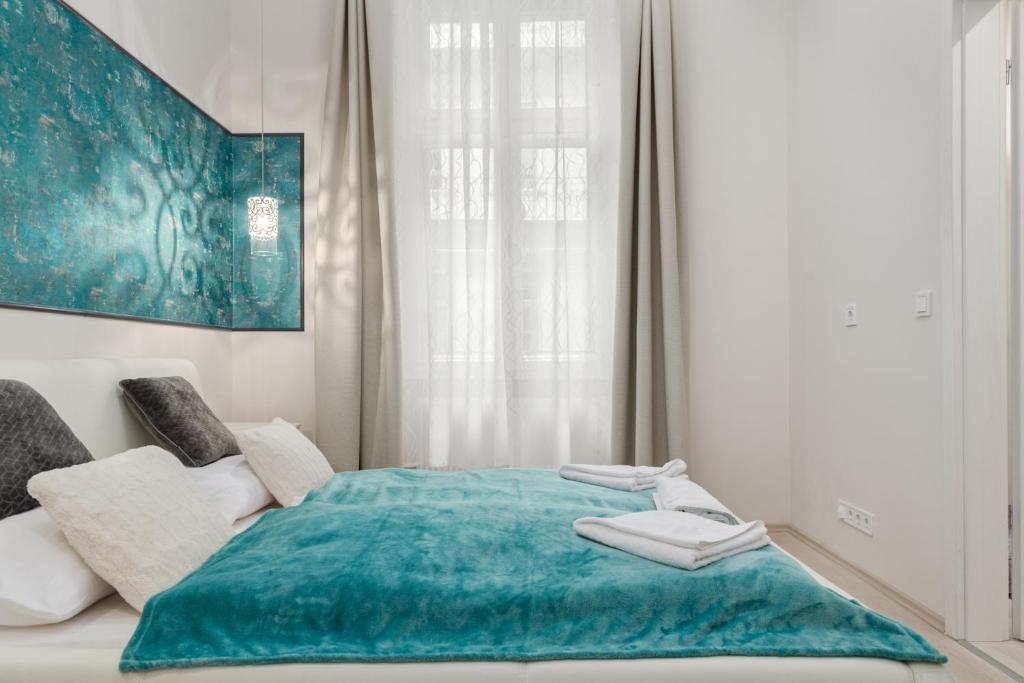 Posteľ alebo postele v izbe v ubytovaní P43 Paulay Apartment