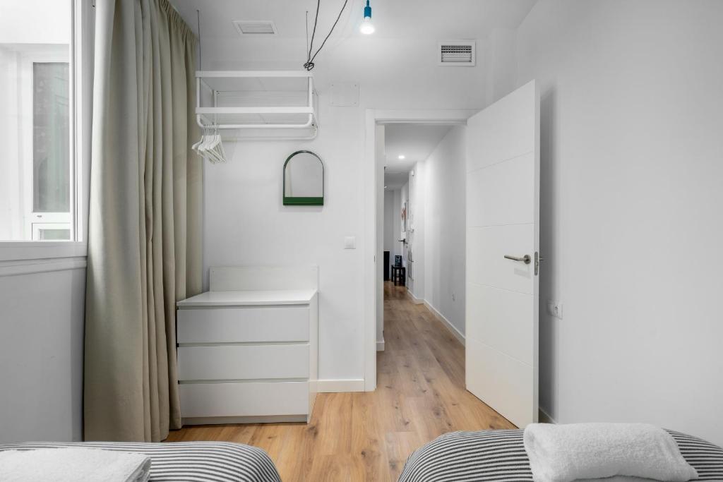Posteľ alebo postele v izbe v ubytovaní SOHO ARTS DUPLEX CENTRO by AlohaMalaga