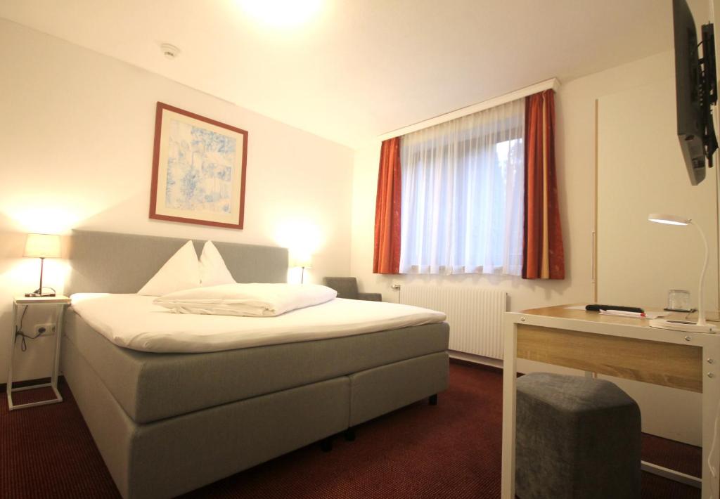 Postel nebo postele na pokoji v ubytování Hotel Altmann