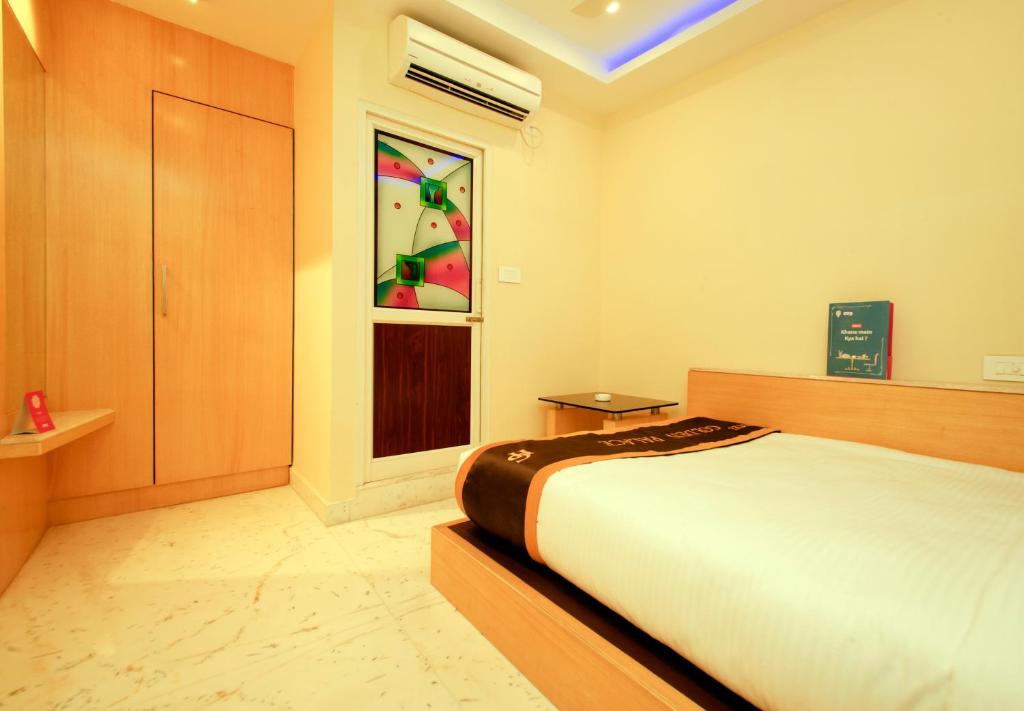 Postel nebo postele na pokoji v ubytování Hotel Golden Palace
