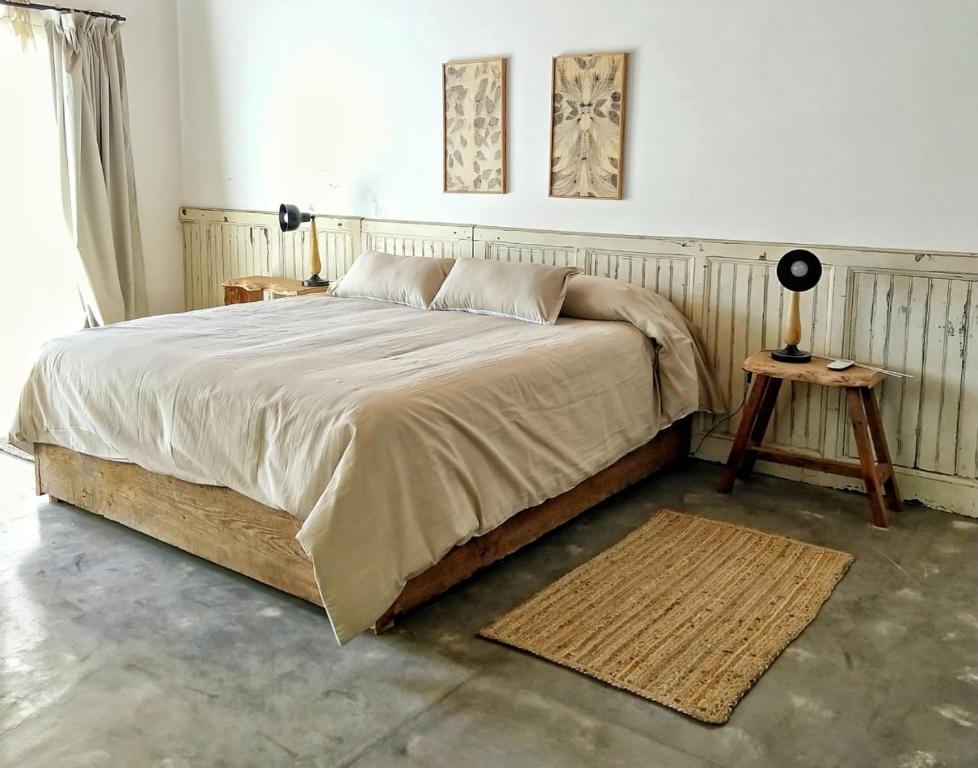 En eller flere senge i et værelse på LA FLORIDA - CASA PUEBLO