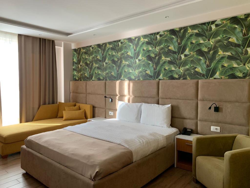 Postel nebo postele na pokoji v ubytování Albanian Star Hotel