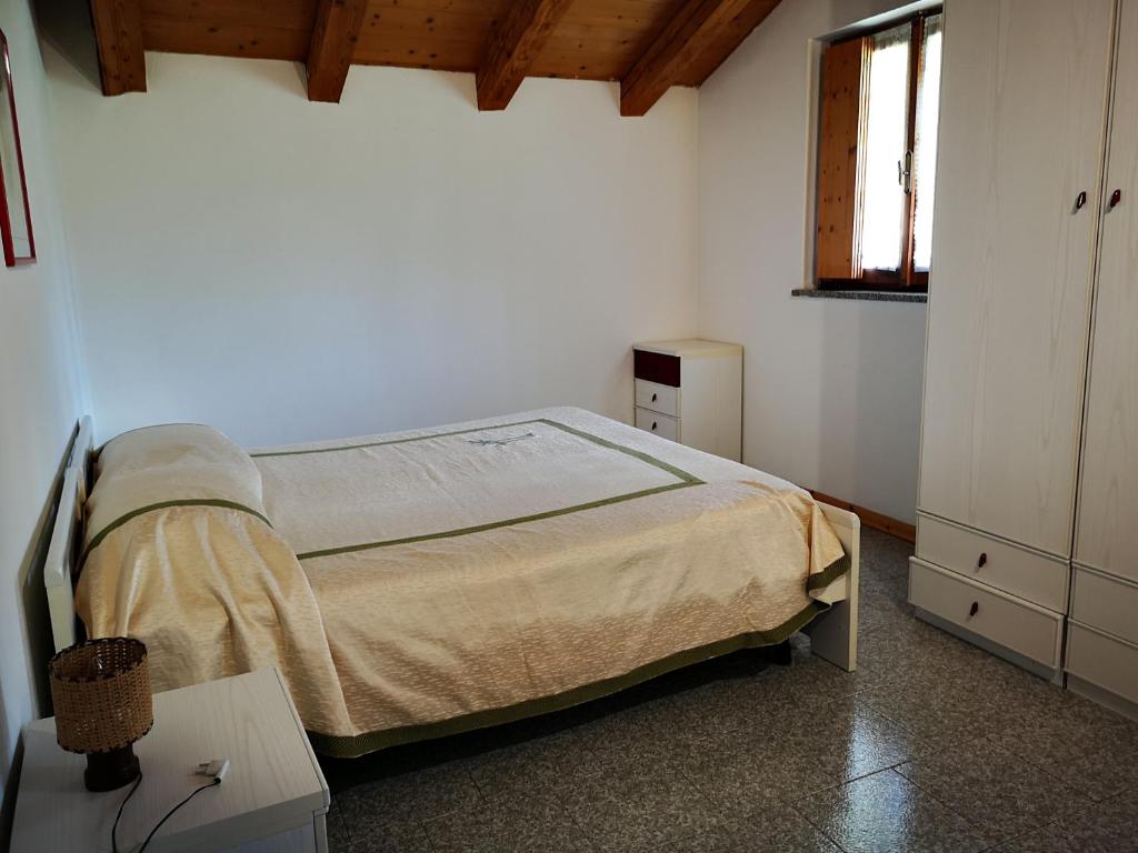 Postel nebo postele na pokoji v ubytování Giò Appartamenti Vacanze
