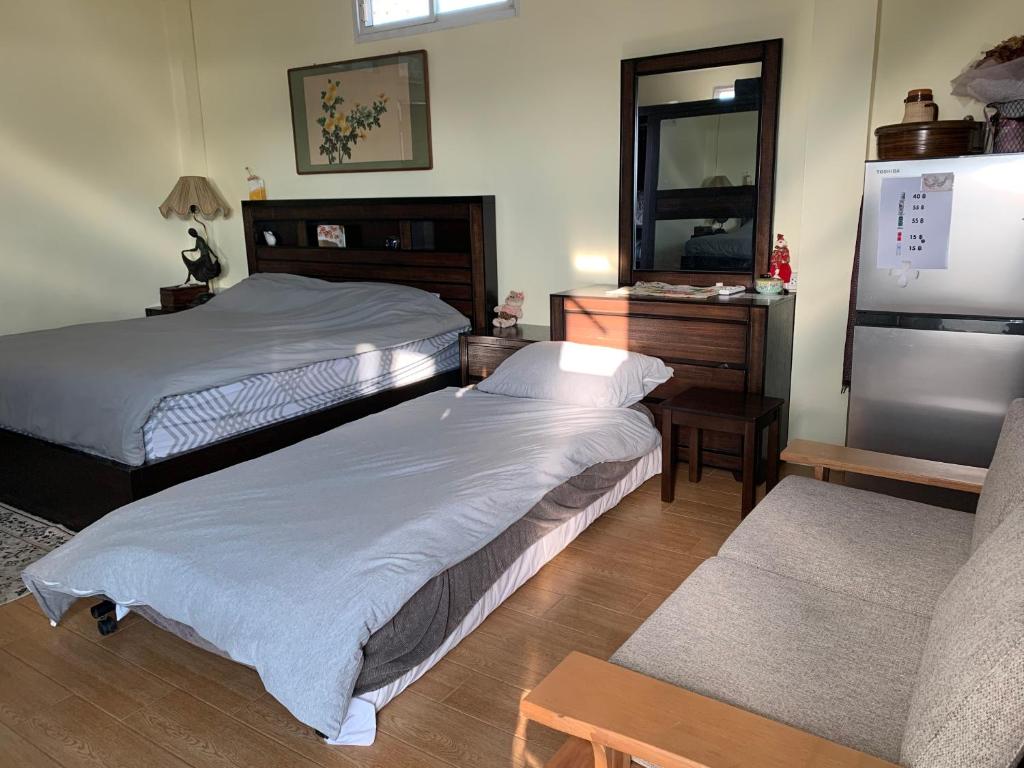 Postel nebo postele na pokoji v ubytování Gumpuju คำปู้จู้