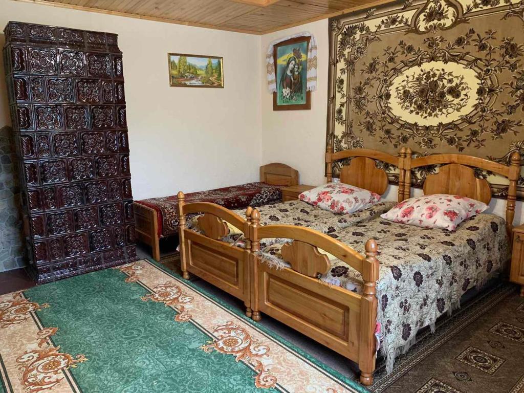 Postel nebo postele na pokoji v ubytování Приватна садиба Яблуневий сад 1